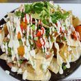 Corn tortilla chips topped with house-made beer cheese, bacon pinto beans, medley tomato, green onion, jalapeno, avocado, cilantro and jalapeno crema. 